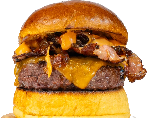 Hamburguesa de txuleta con cheddar fundido, bacon y pan brioche